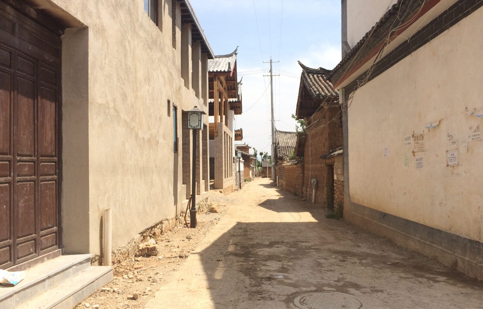 a street with buildings and power lines