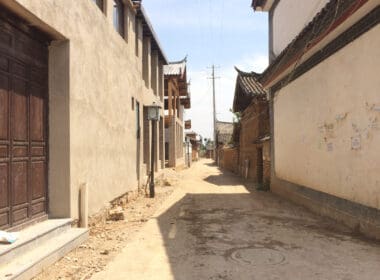 a street with buildings and power lines