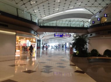 a large building with many windows and a walkway
