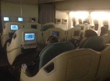 a group of people sitting in an airplane