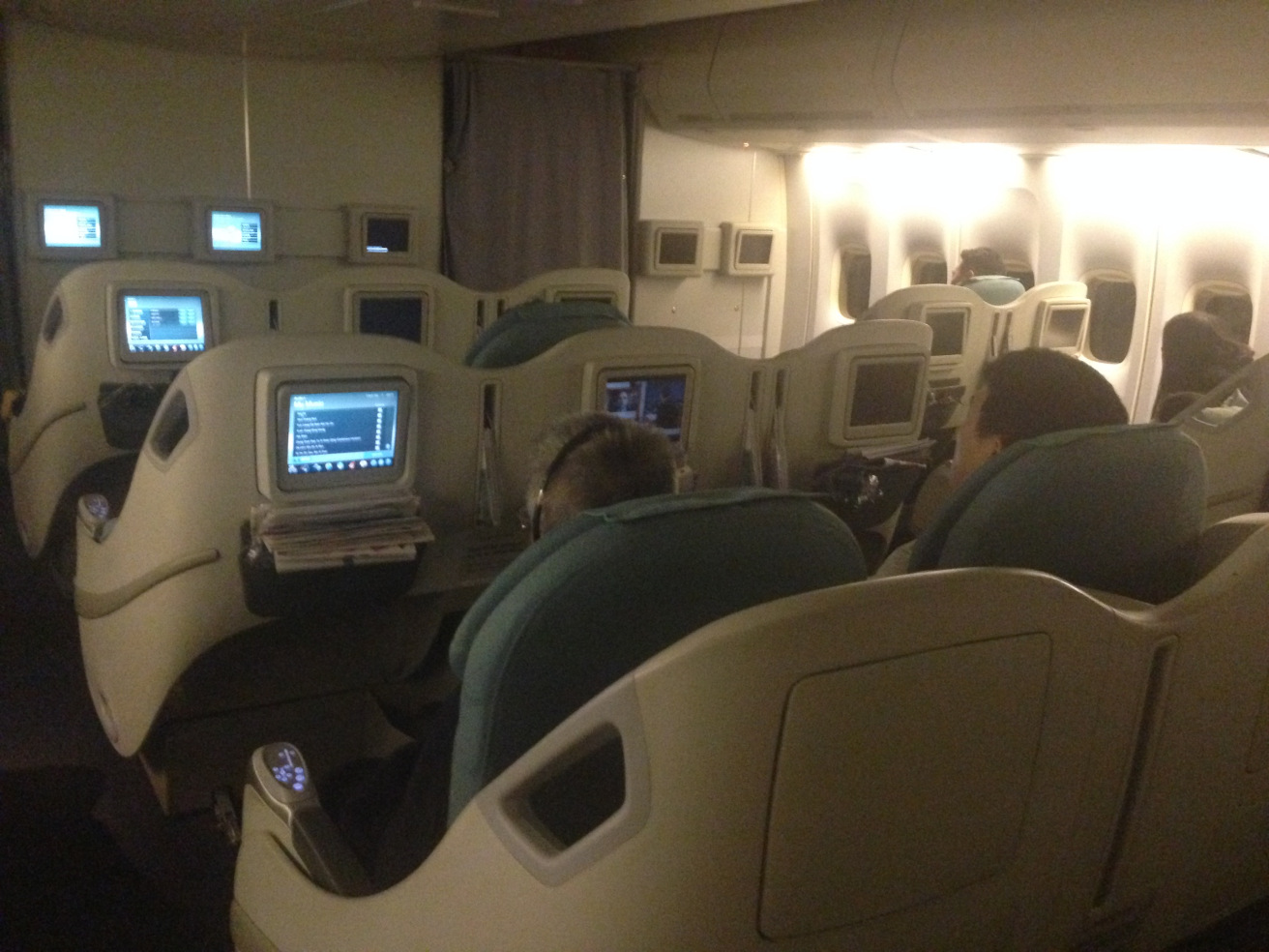 a group of people sitting in an airplane