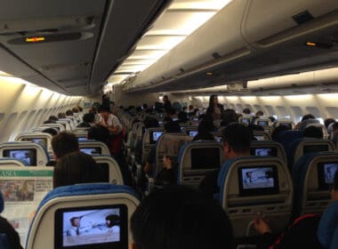 a group of people sitting in an airplane