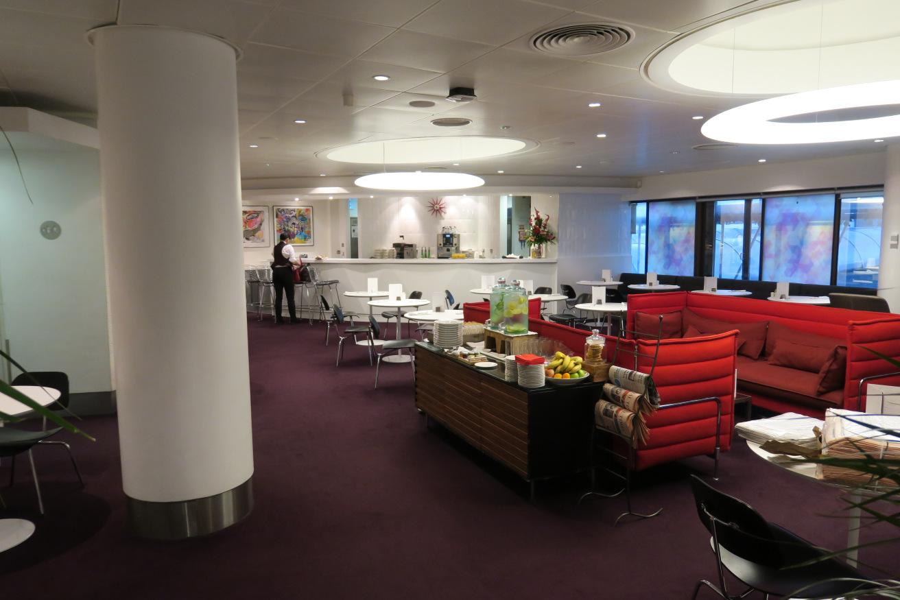 a room with red chairs and tables