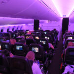 a group of people sitting in an airplane