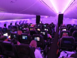 a group of people sitting in an airplane