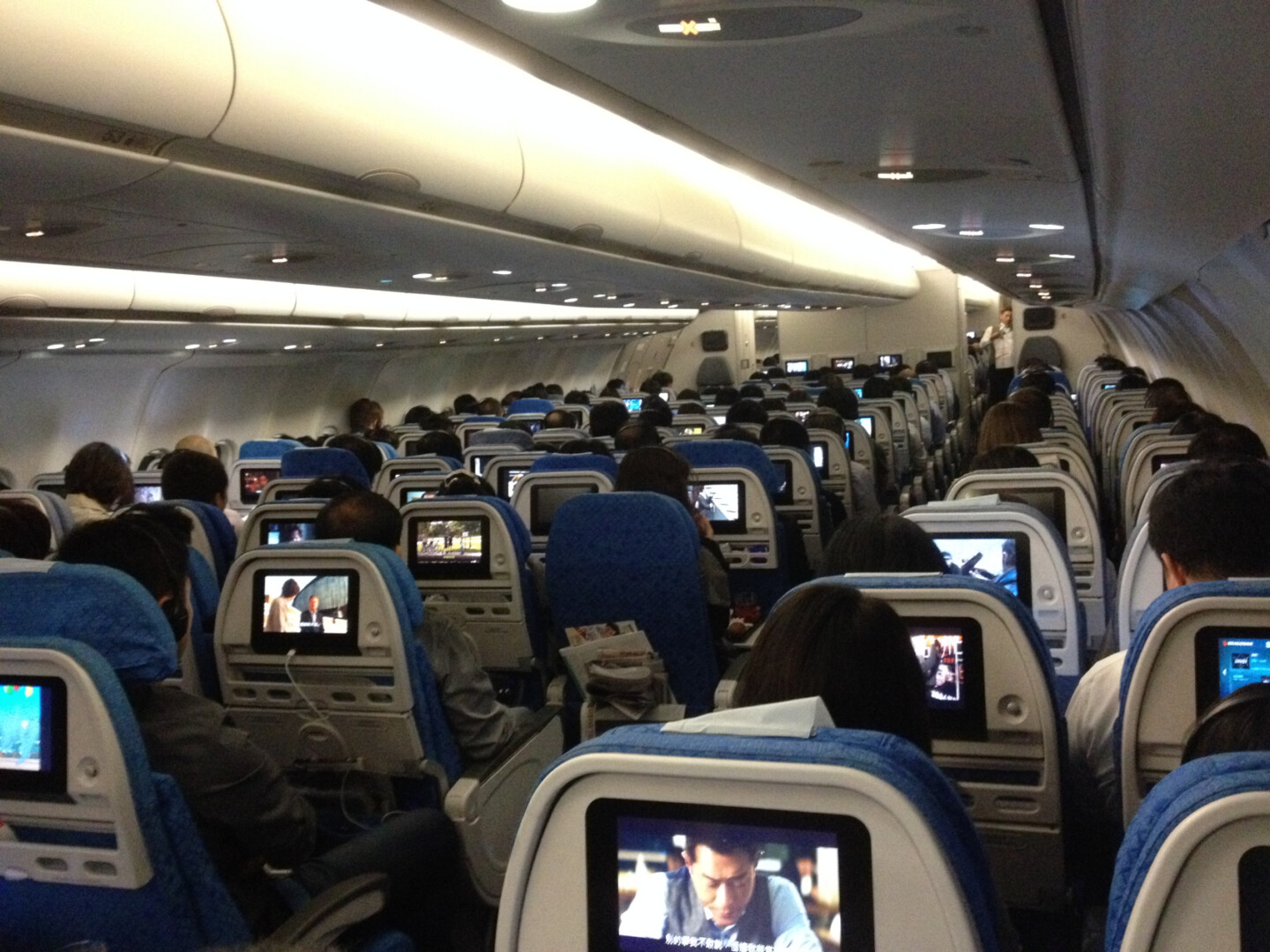 a group of people sitting in an airplane