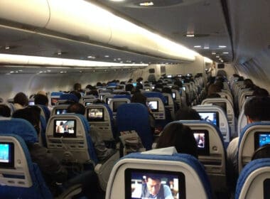 a group of people sitting in an airplane