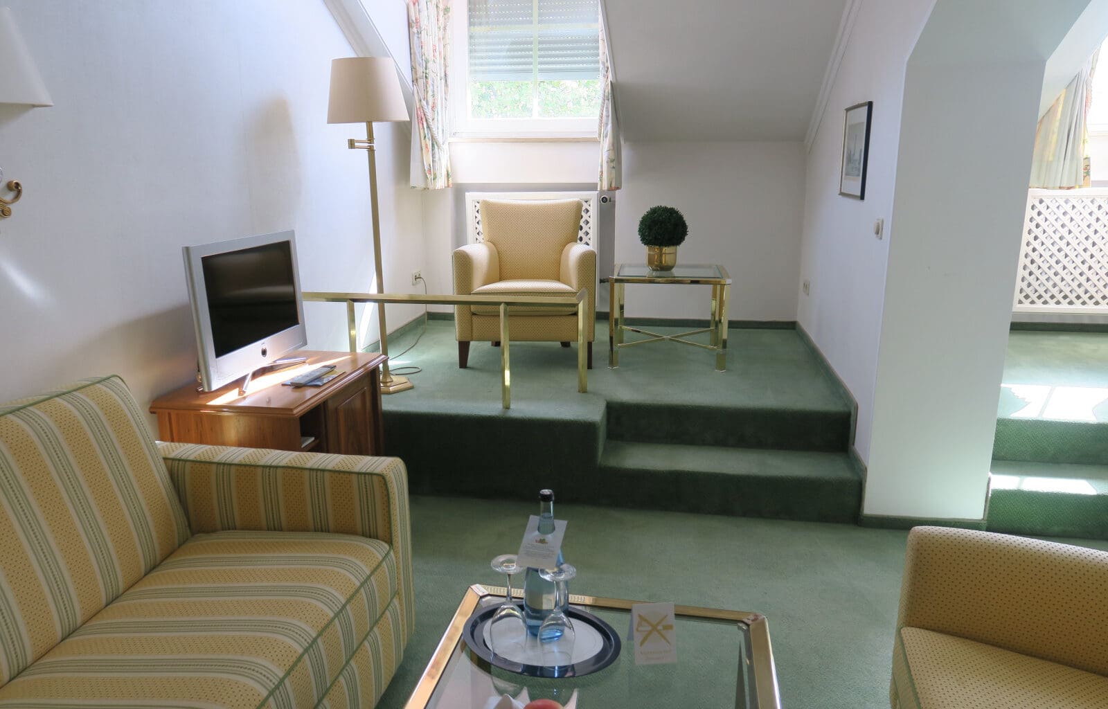 a living room with a television and a couch