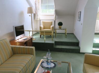 a living room with a television and a couch