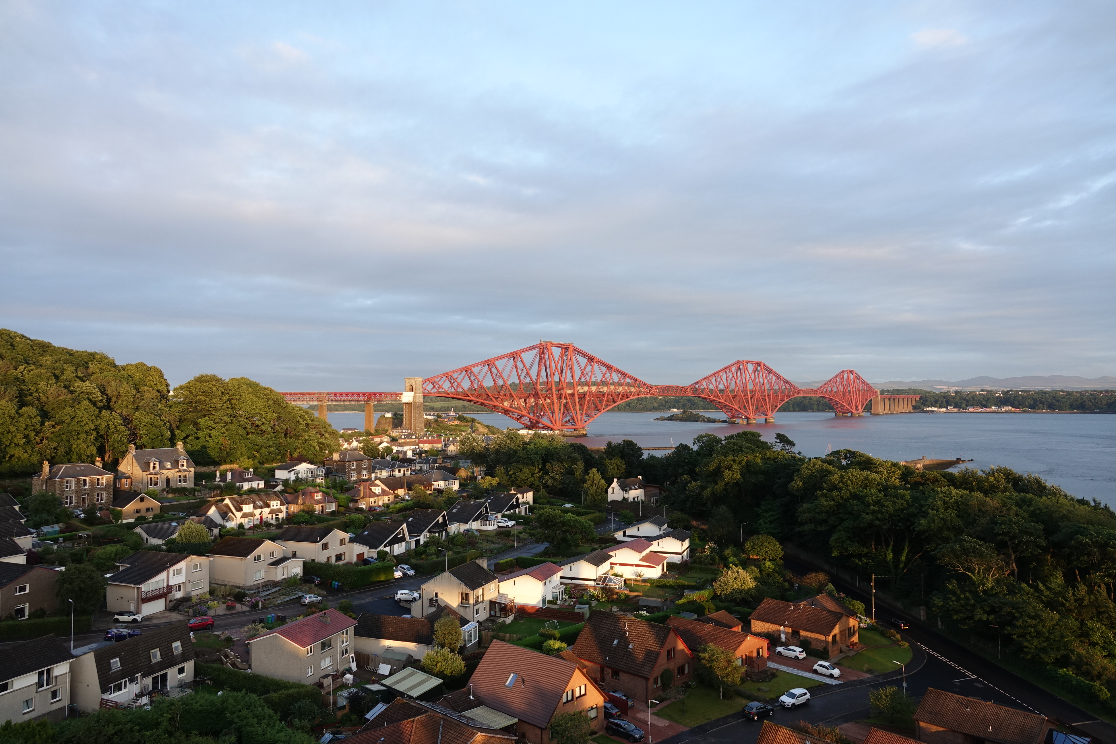 a red bridge over water