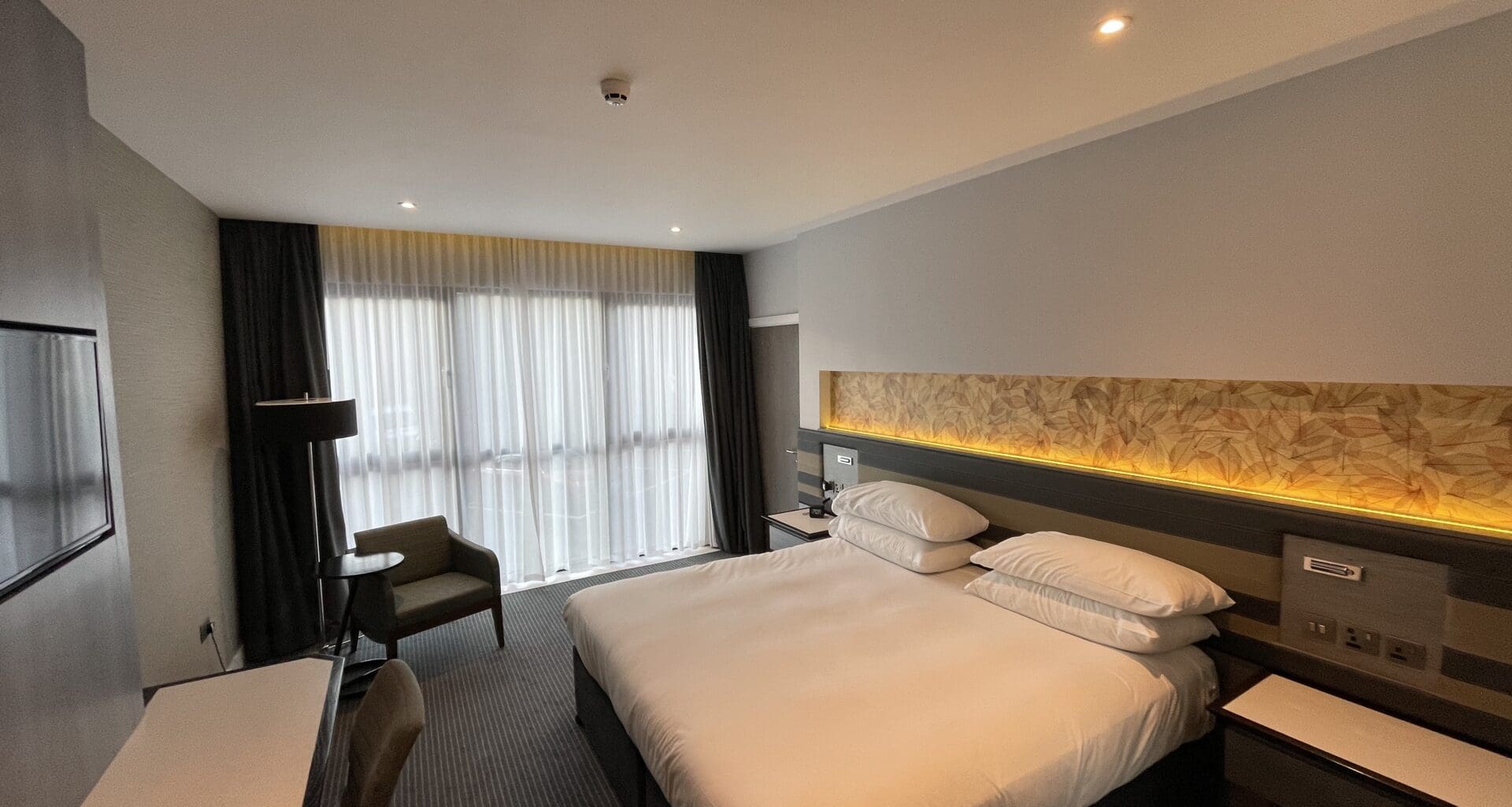 a room with a bed and a desk