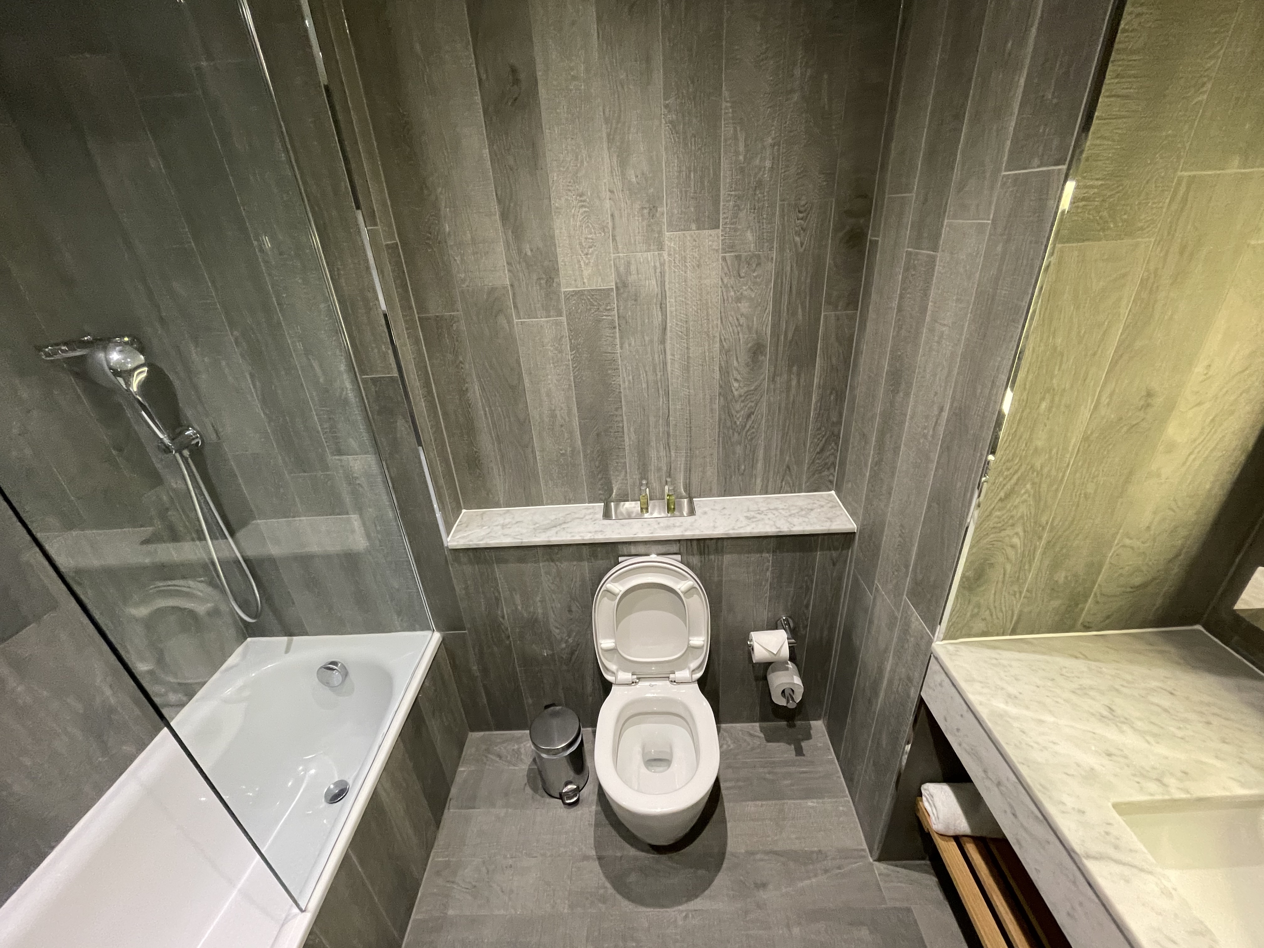 a bathroom with a toilet and tub