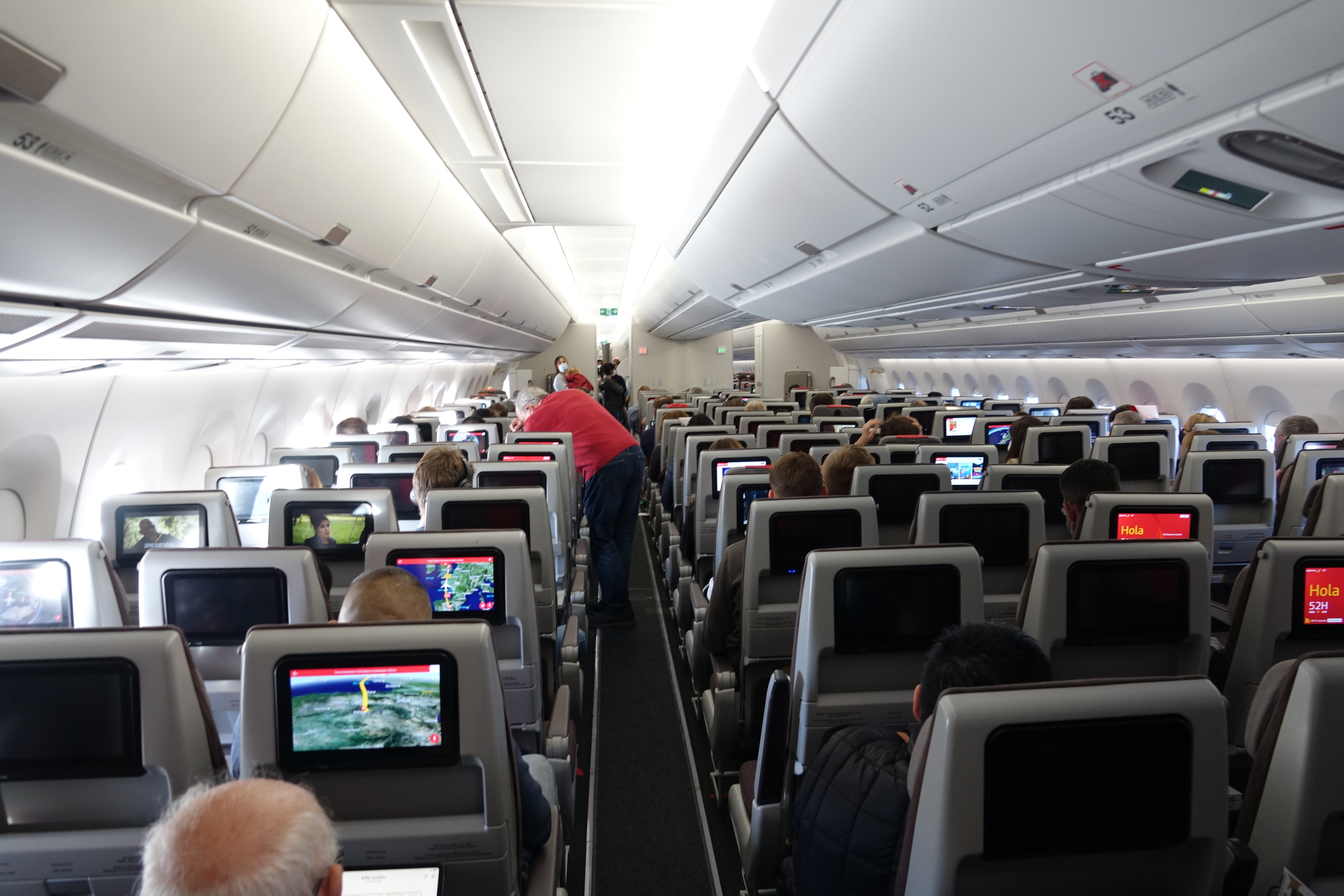 a group of people sitting in an airplane