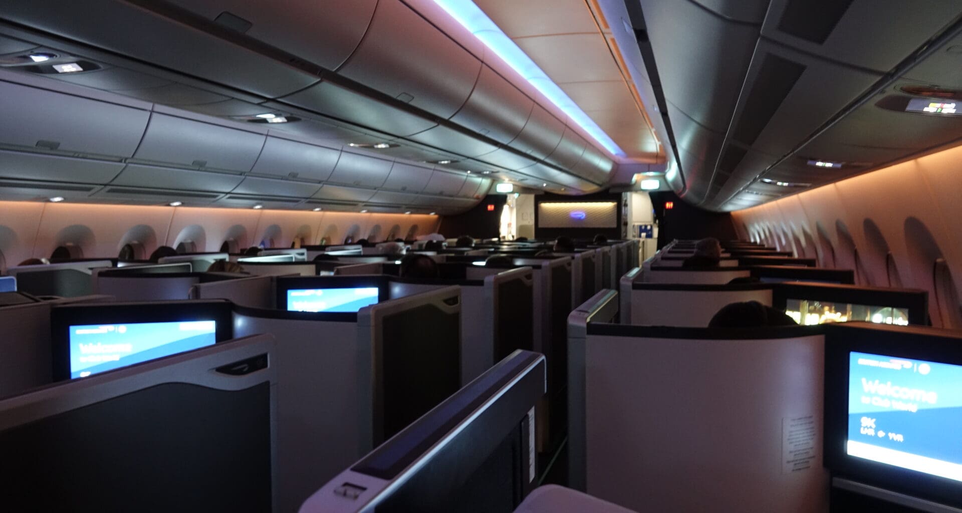 an airplane with seats and monitors