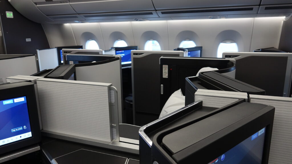 a row of monitors on an airplane