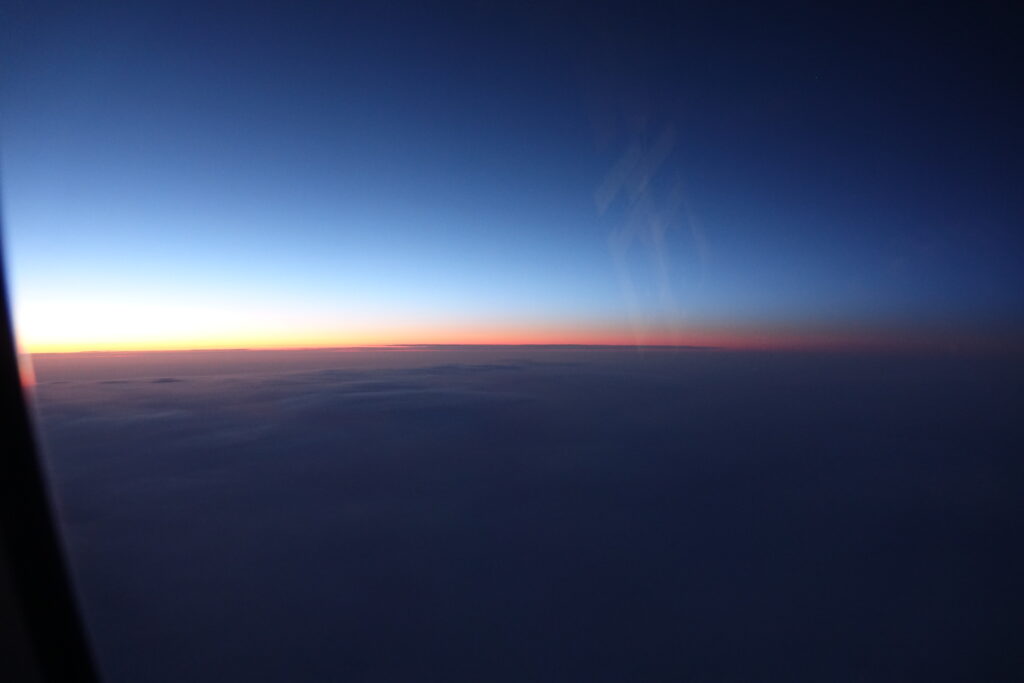 a sunset over the clouds