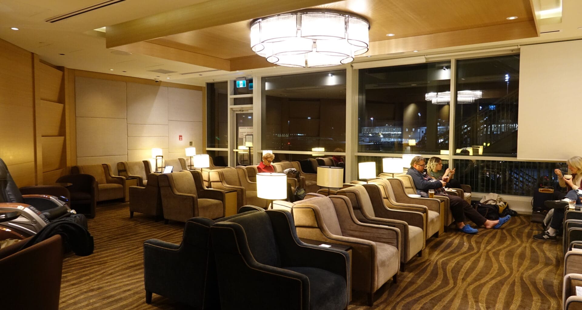 a group of people sitting in chairs in a room