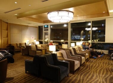 a group of people sitting in chairs in a room
