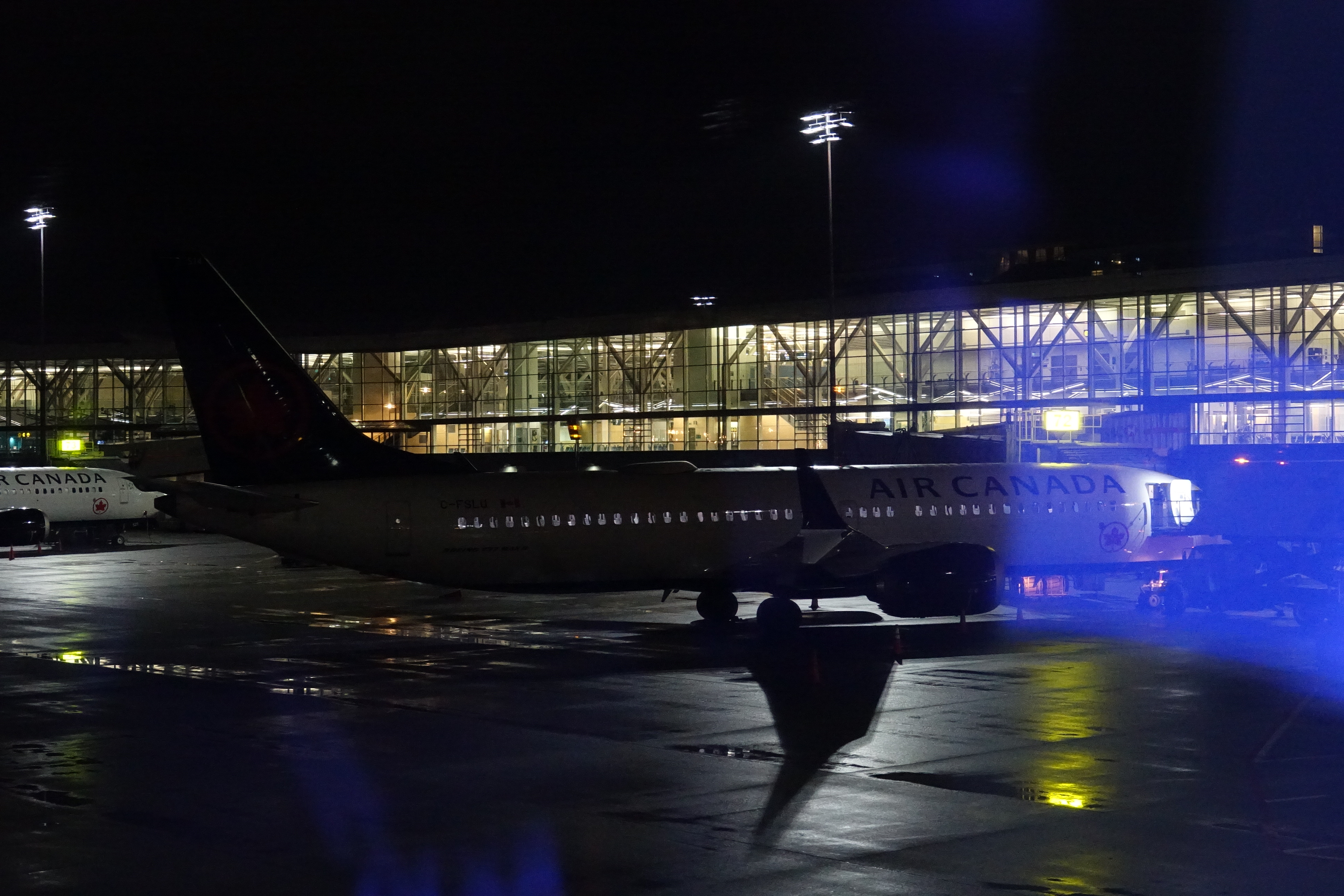 an airplane on the tarmac at night