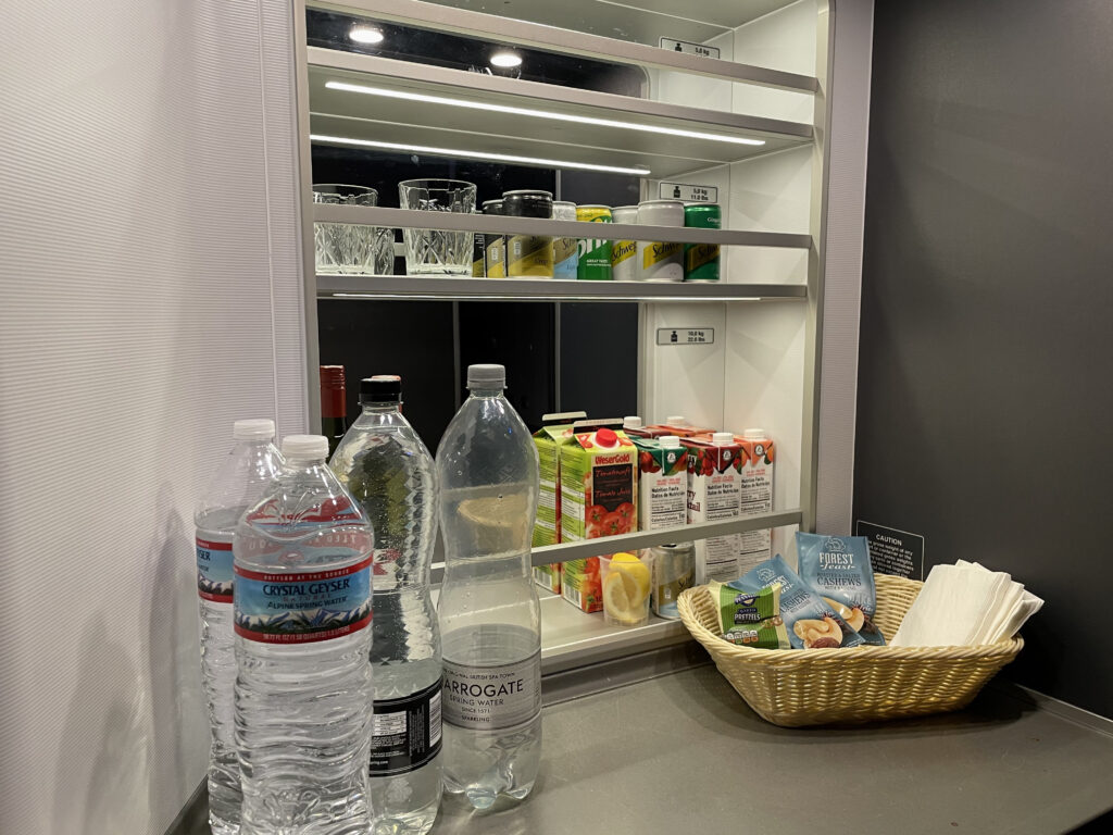 a shelf with food and drinks on it