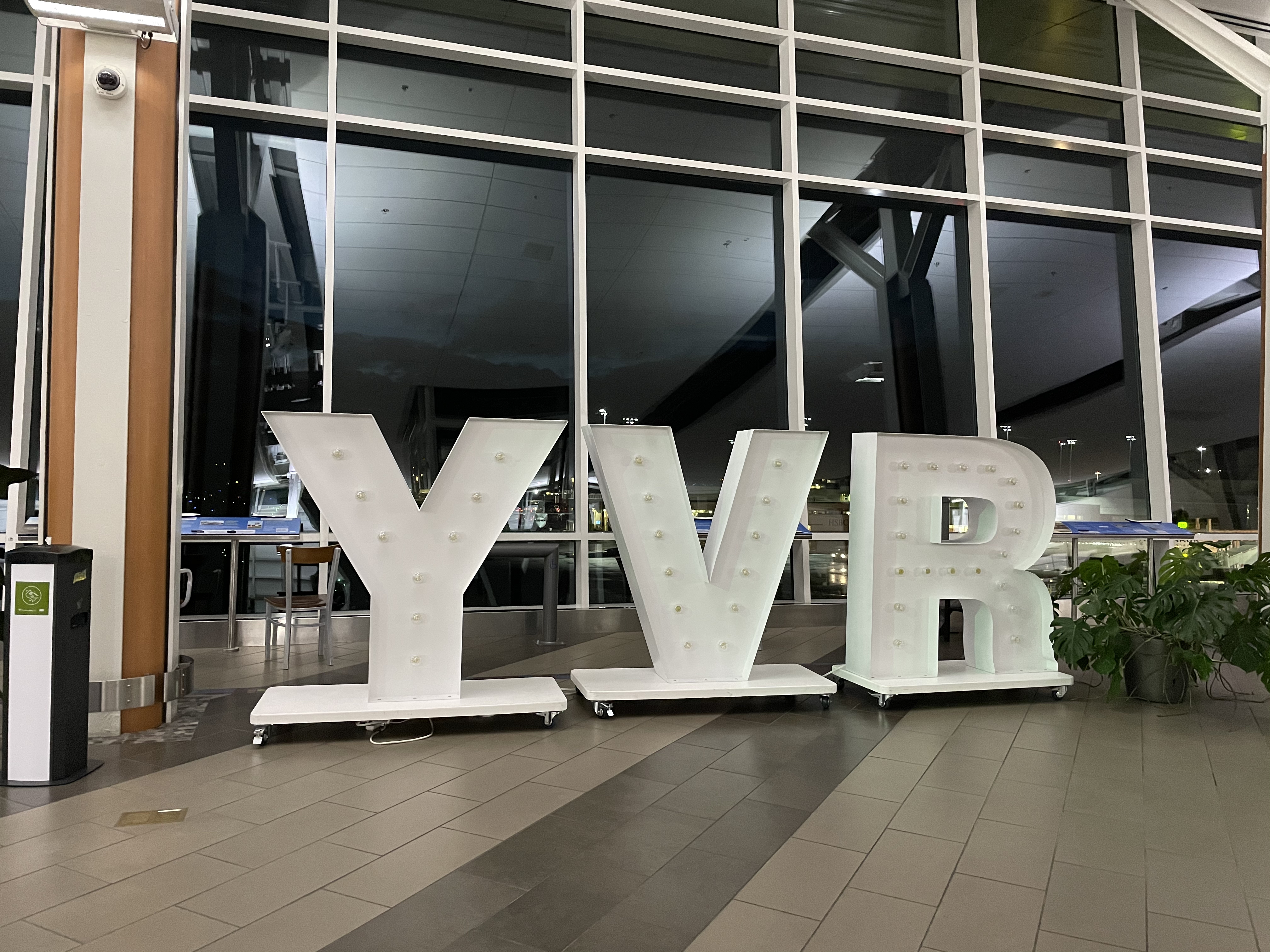 large white letters in front of a large window