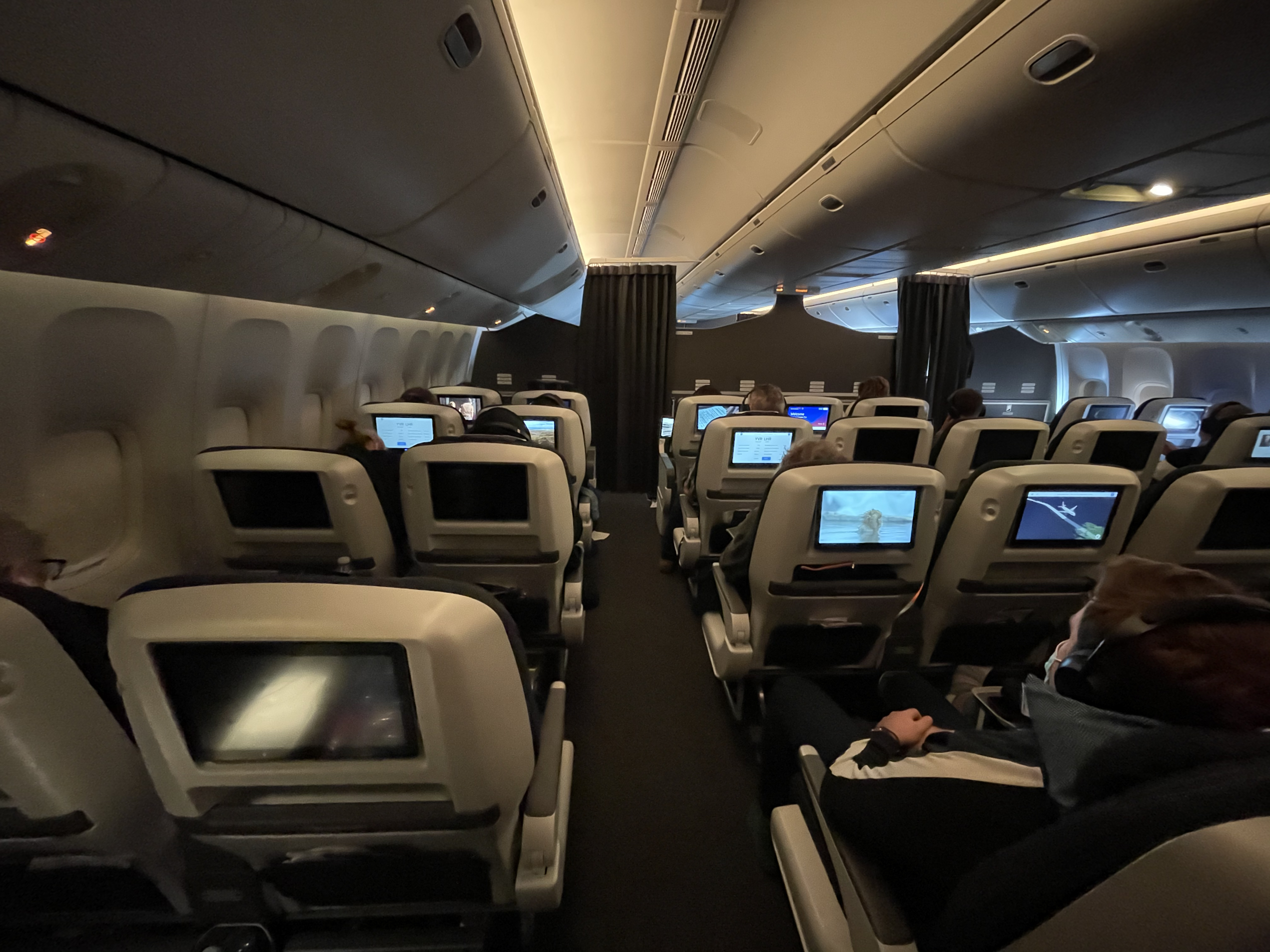 a group of people sitting in an airplane