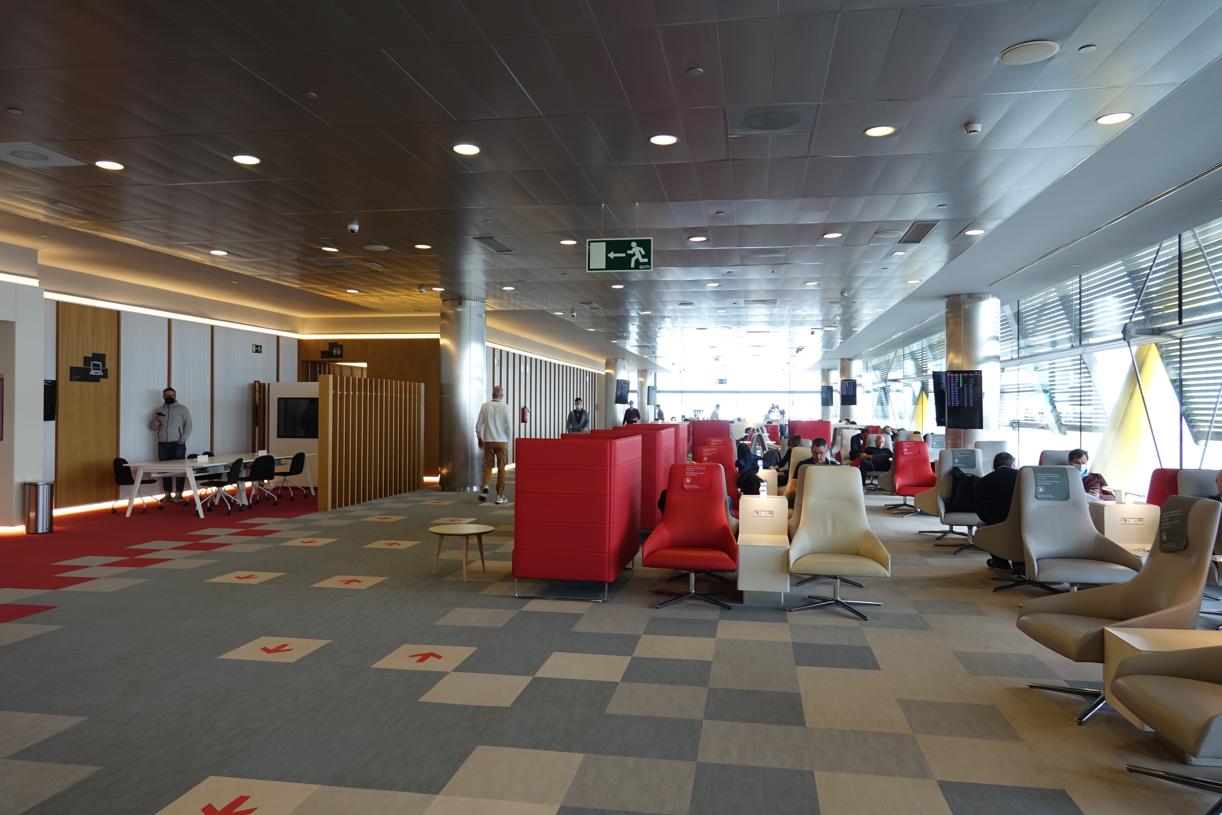 a room with red chairs and tables