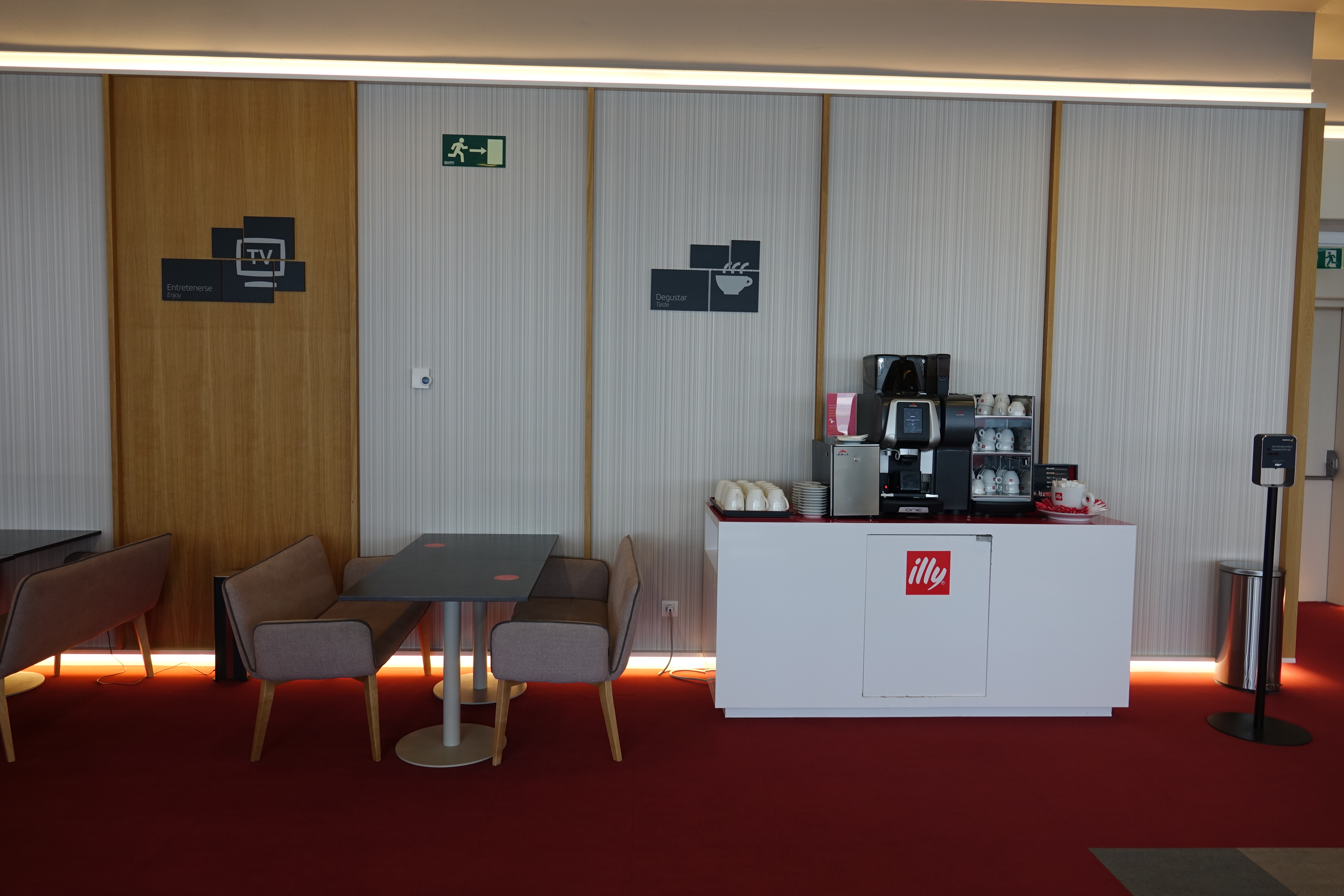 a coffee machine and a table in a room