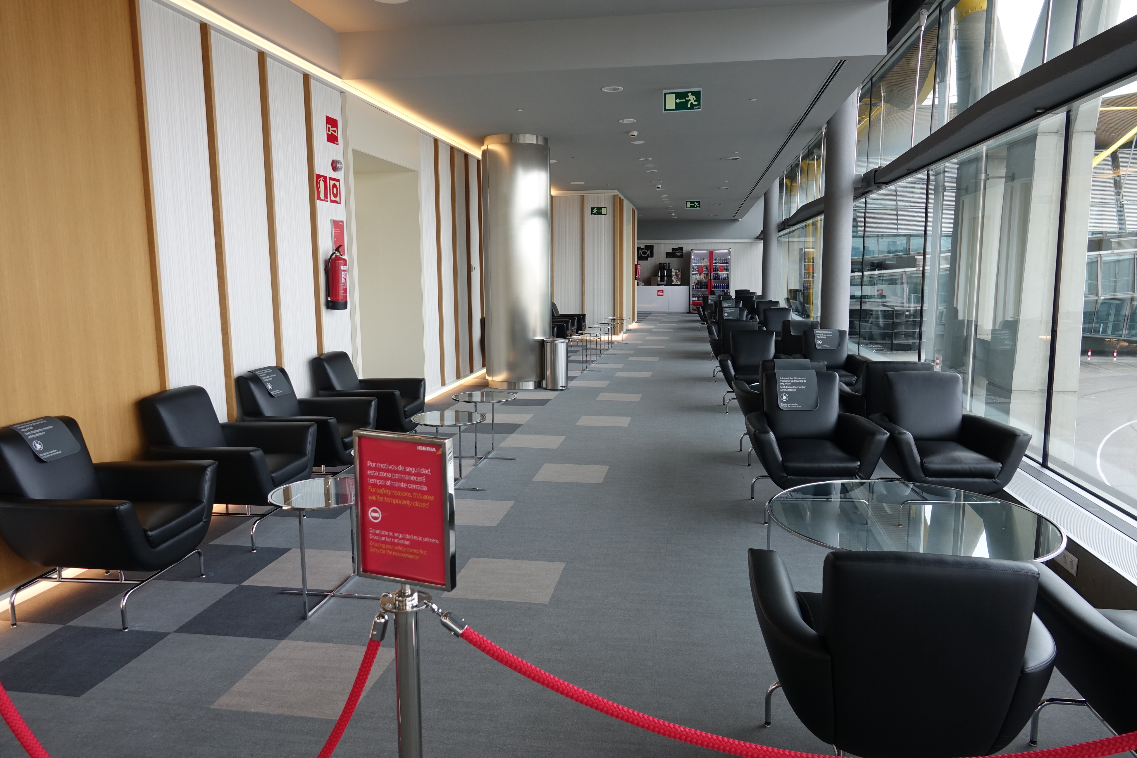 a room with chairs and a red rope