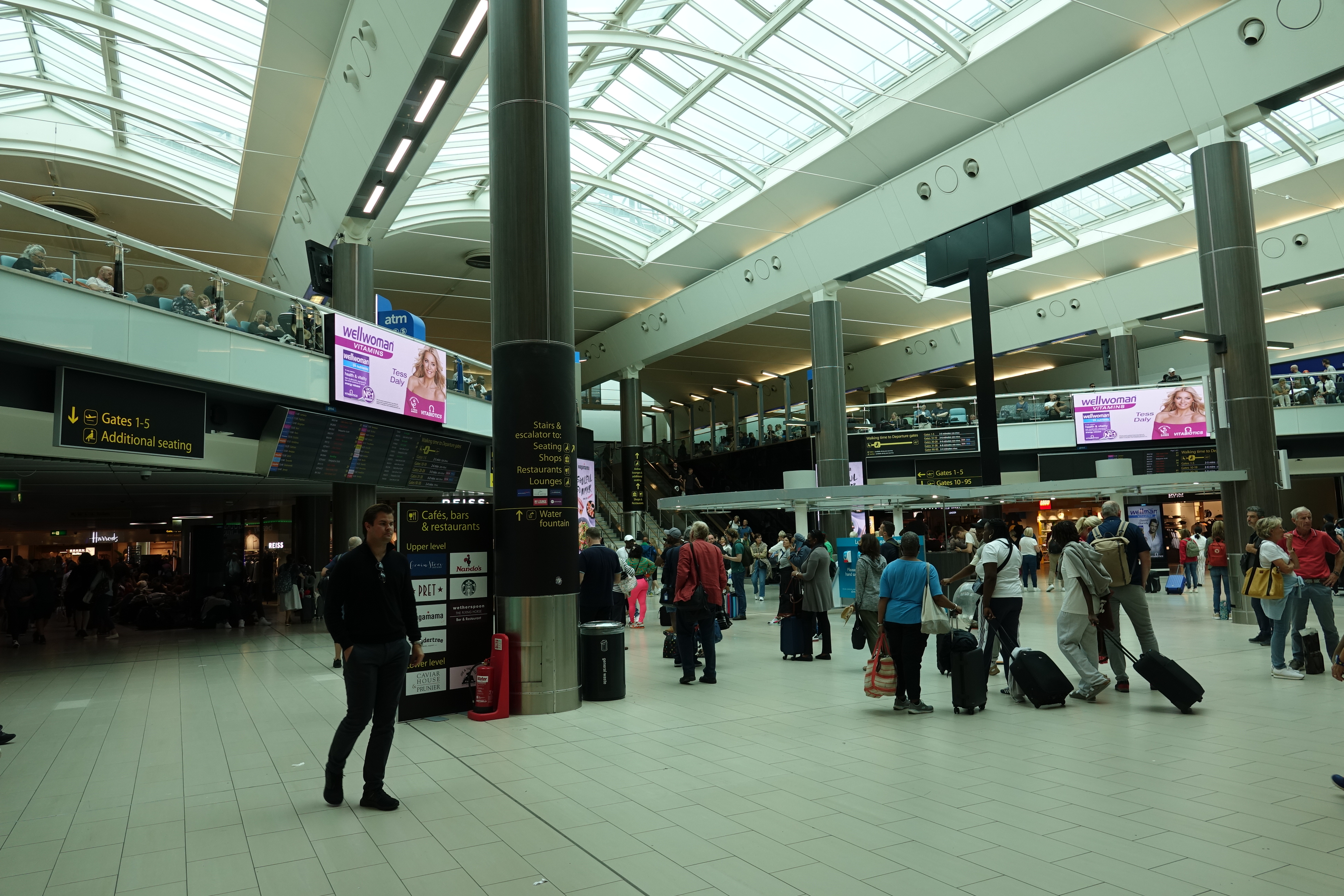 a group of people in a large airport