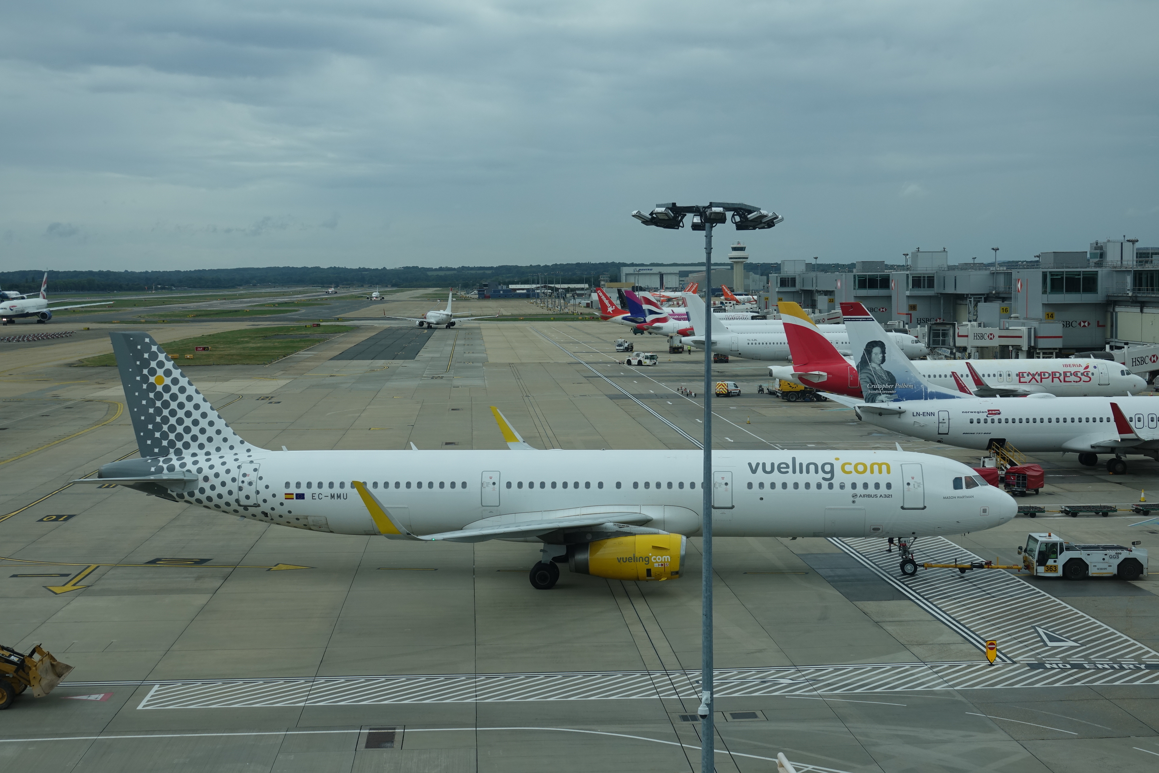 a group of airplanes parked on a runway