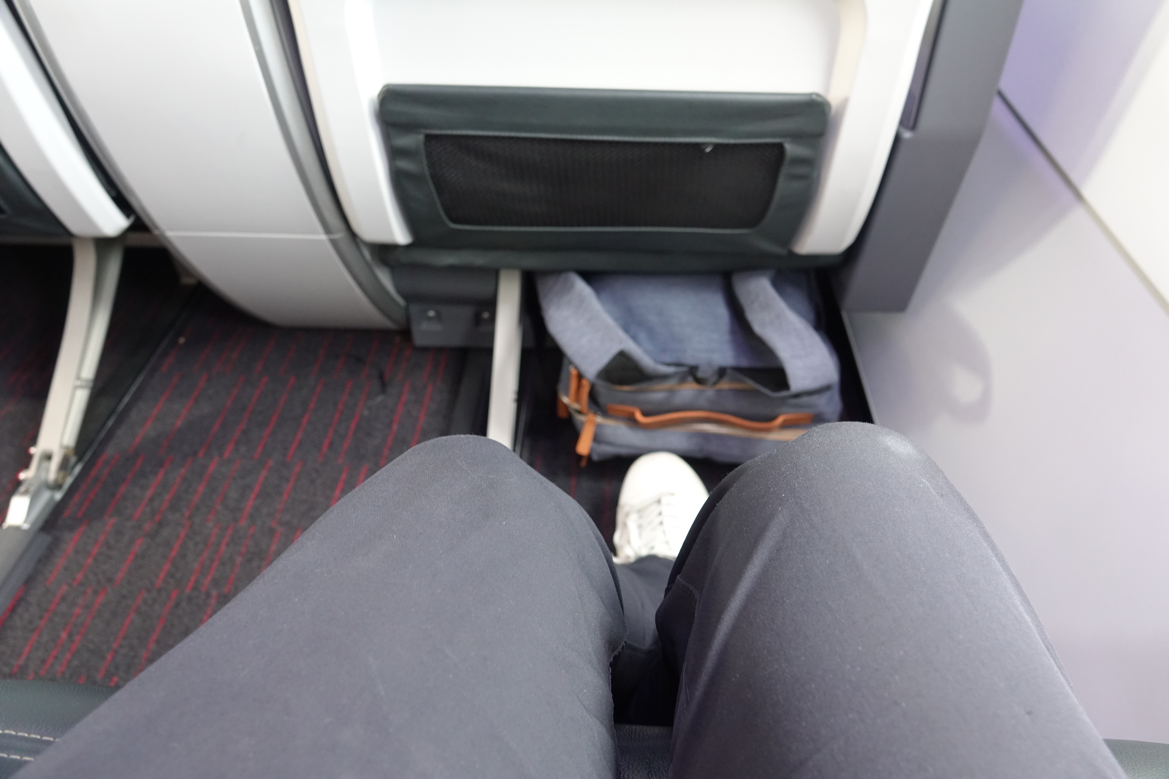 a person's legs in a seat