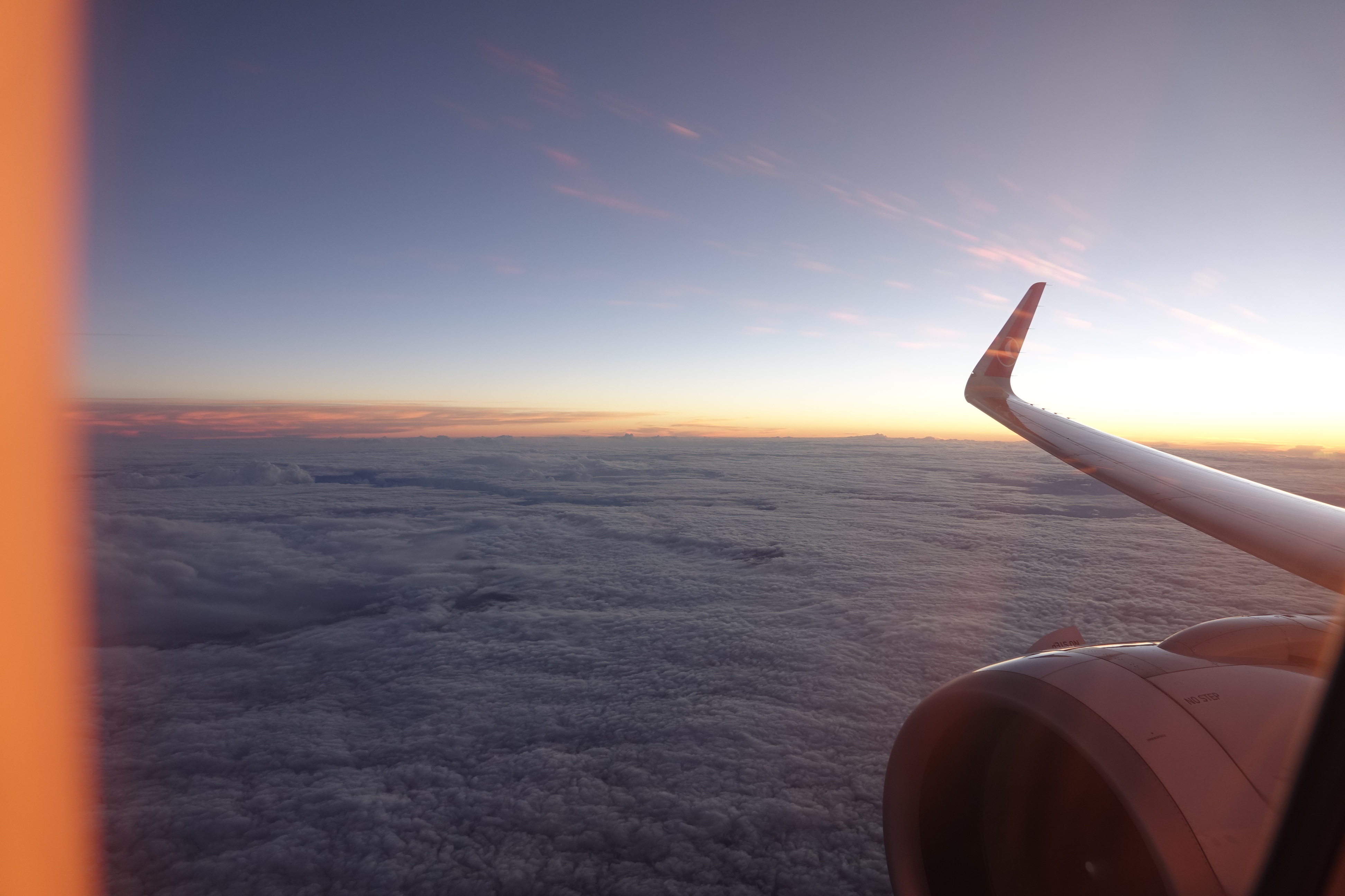 an airplane wing and the sky