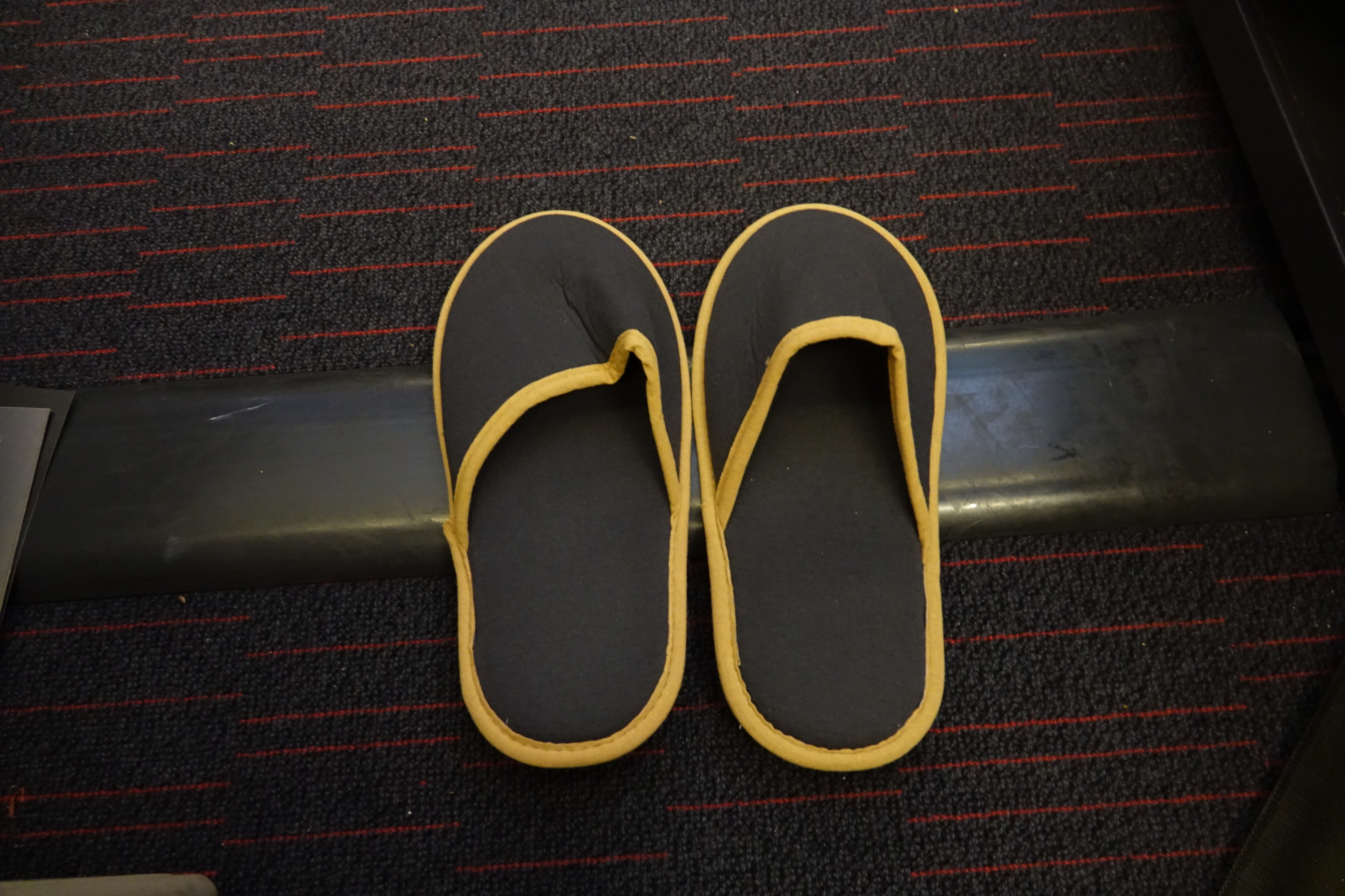 a pair of slippers on a carpet