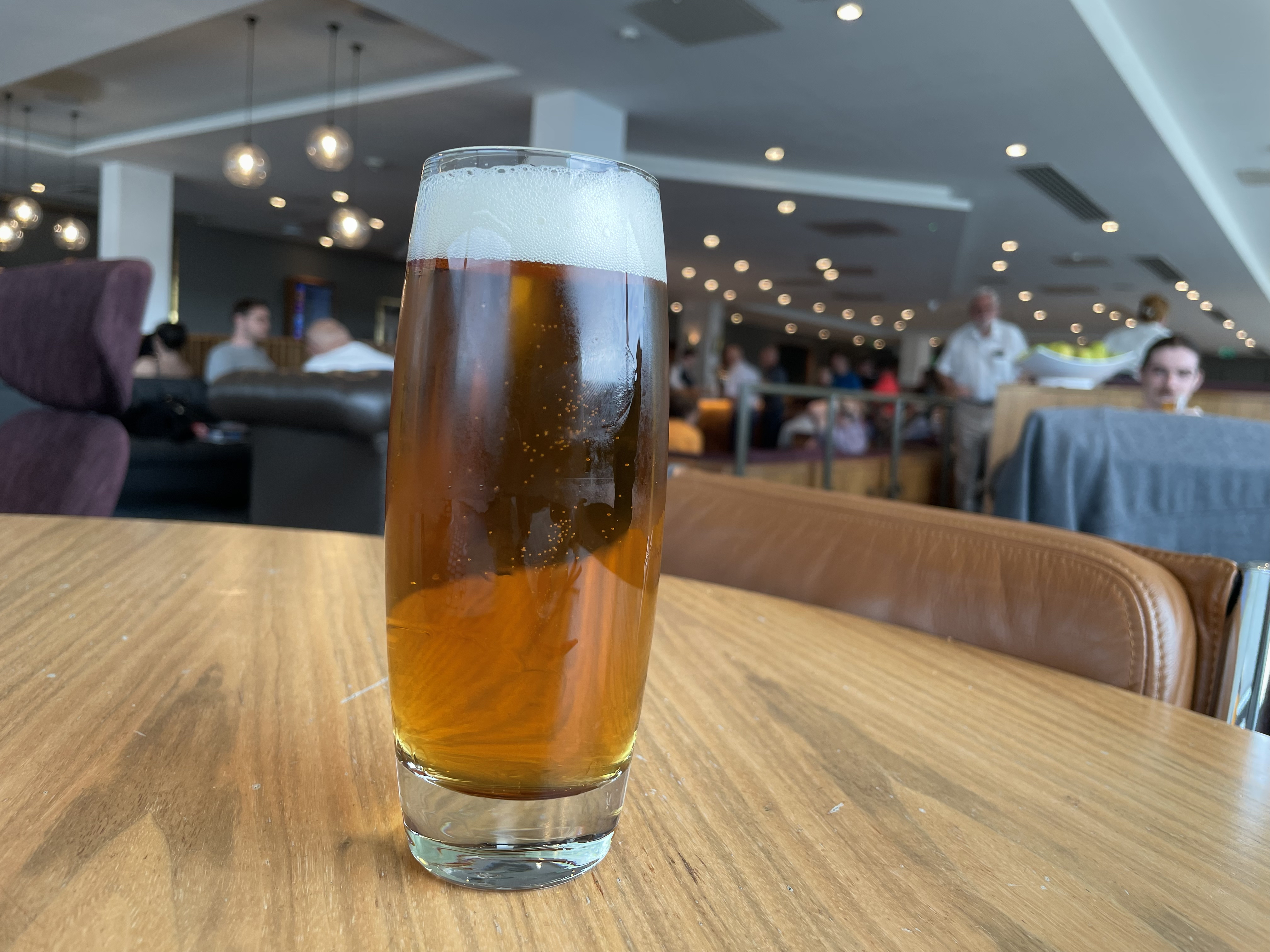 a glass of beer on a table