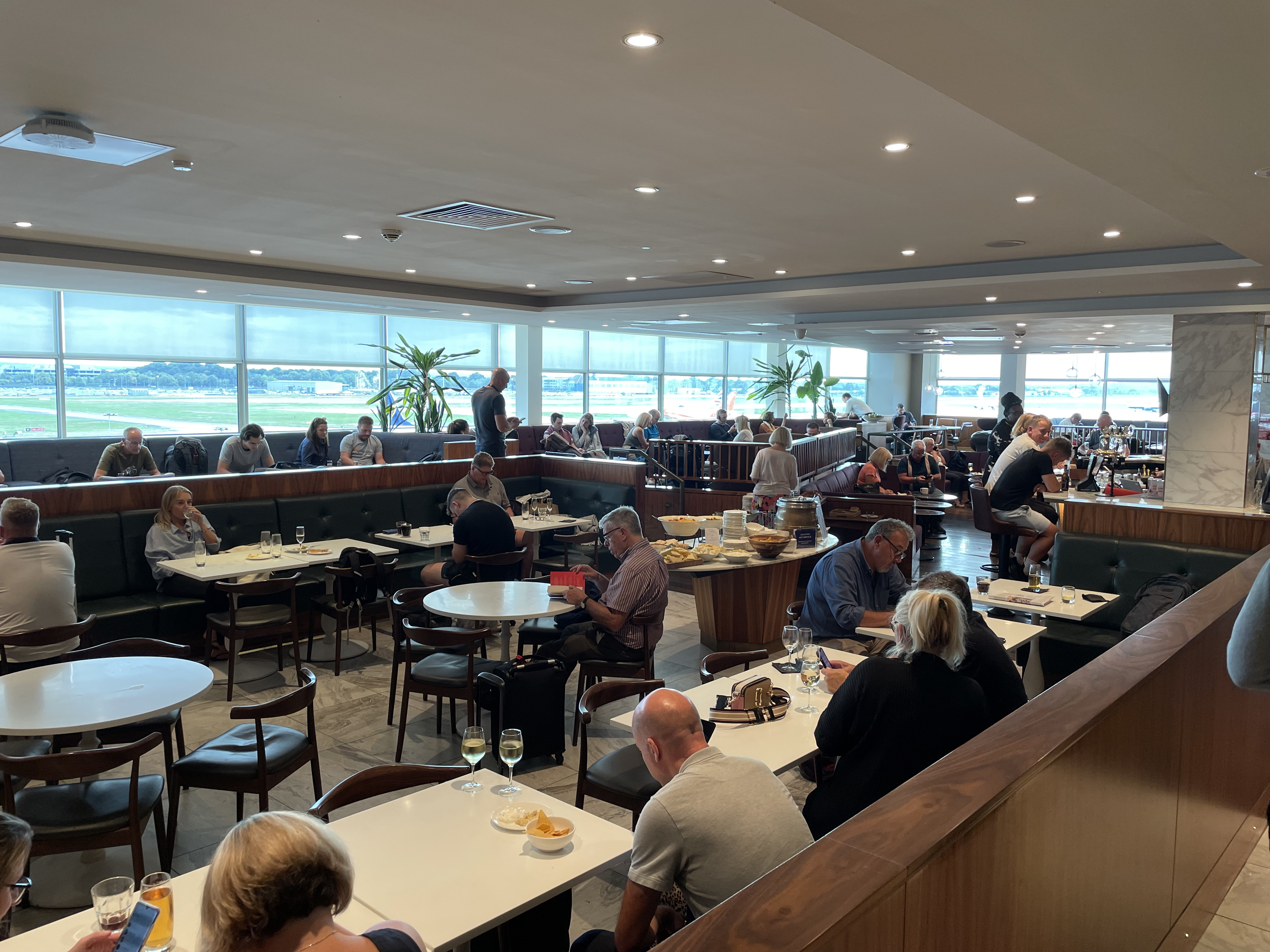 a group of people sitting at tables in a large room