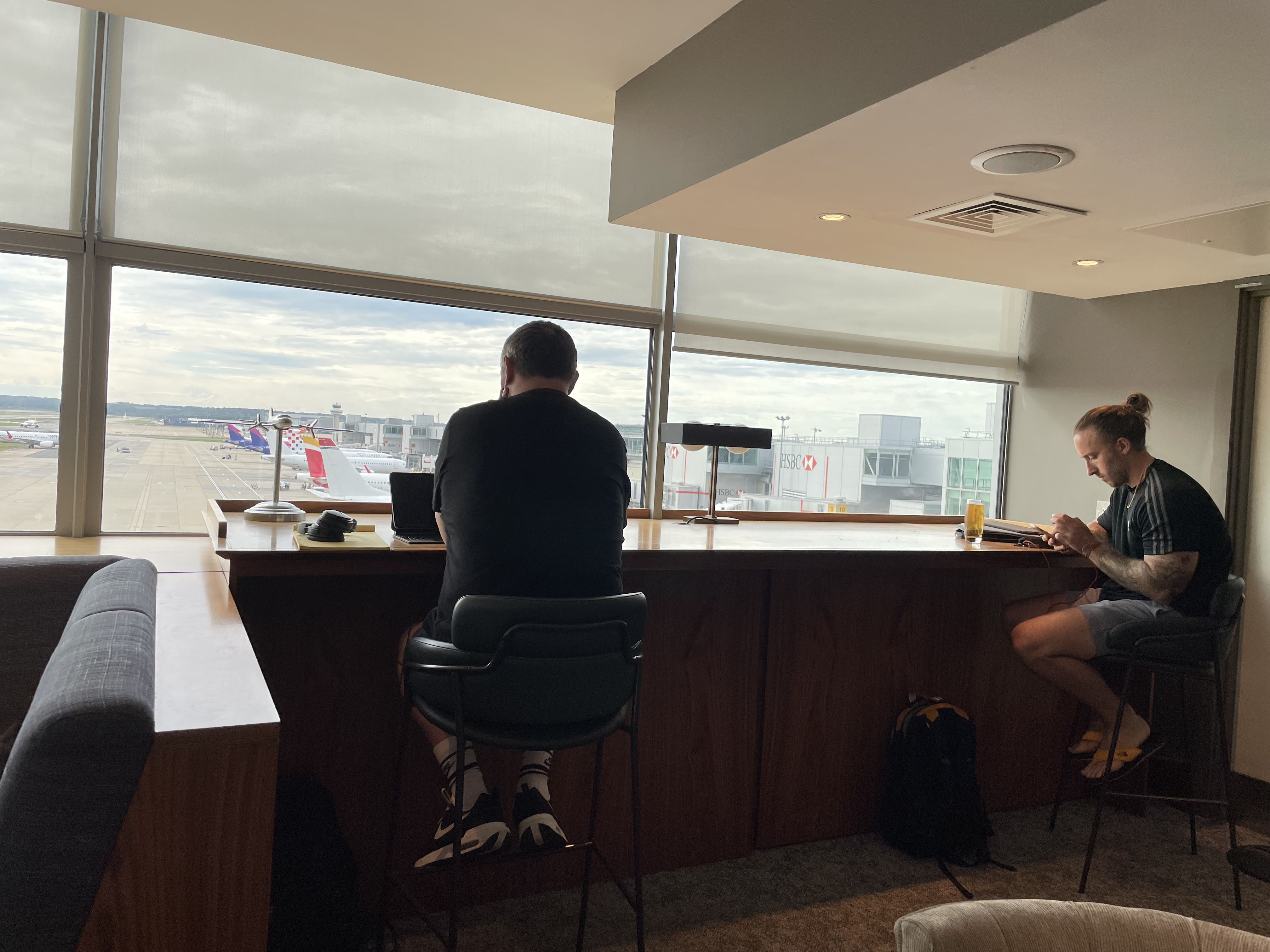 a man sitting at a counter in a room with a window