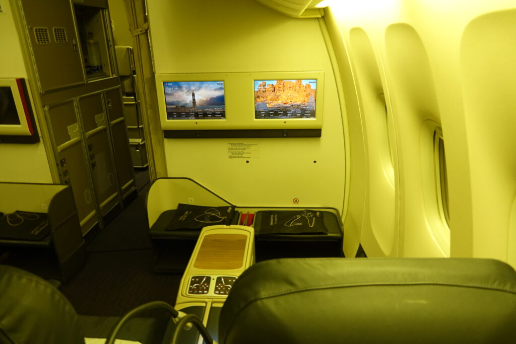 a tvs on the wall of an airplane