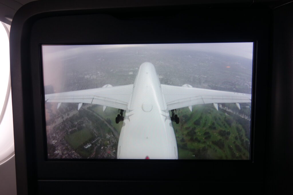 an airplane flying over a city