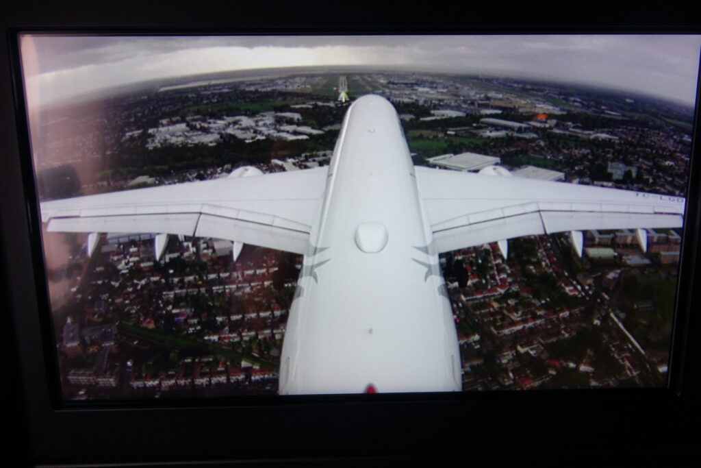 an airplane flying over a city