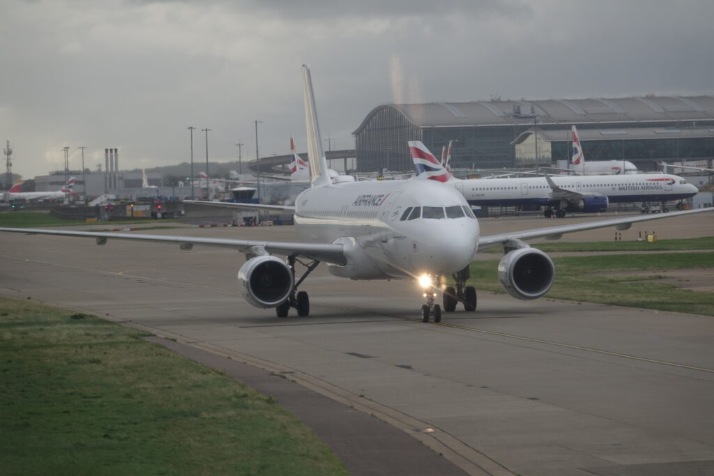 a white airplane on a runway