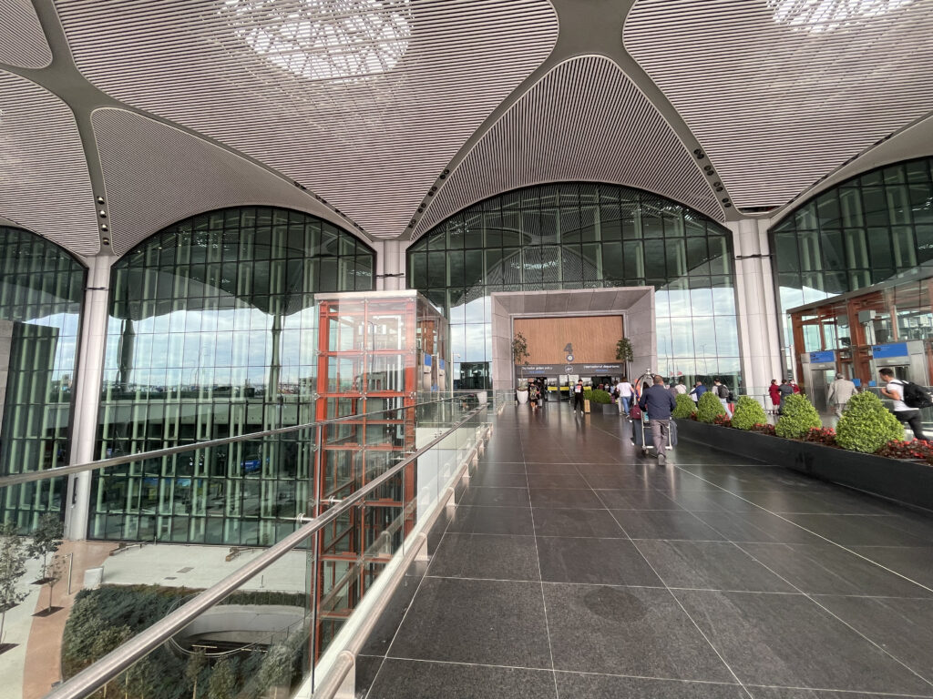 a large building with glass walls and a glass ceiling