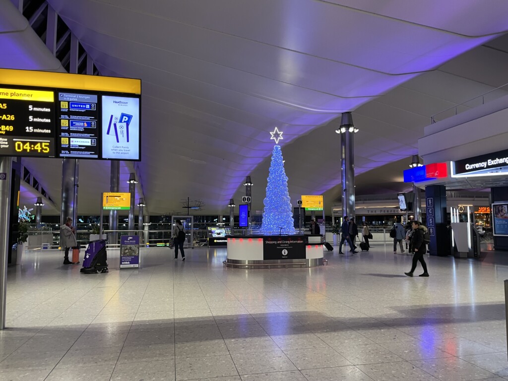 a large illuminated christmas tree in a terminal