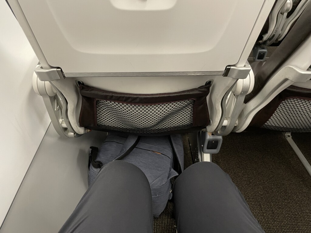 a person's legs in a seat