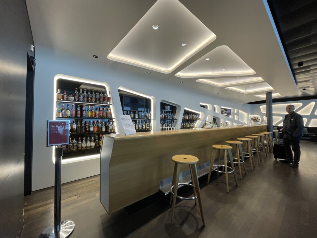 a bar with a counter and stools