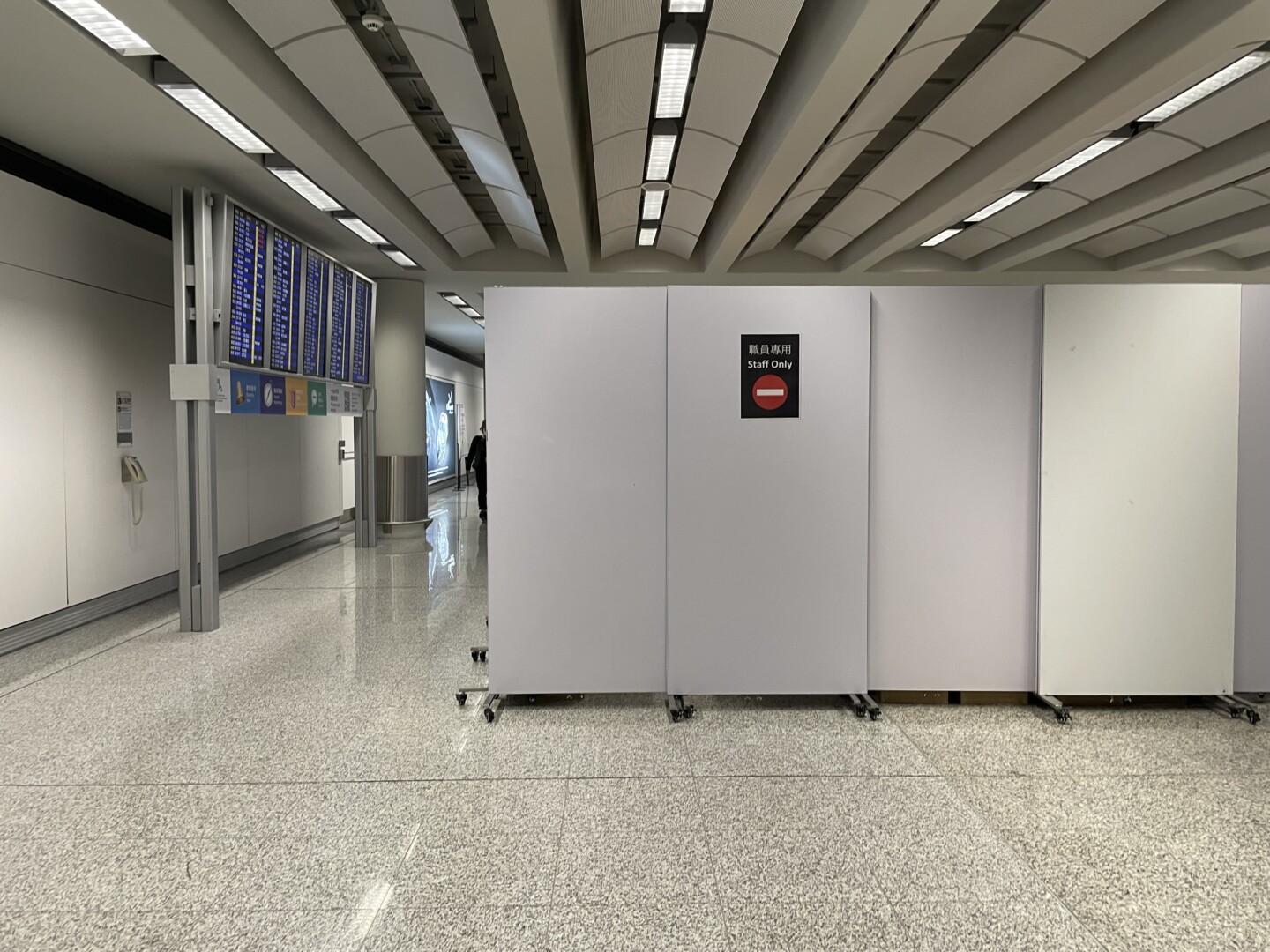 a white rectangular object in a hallway