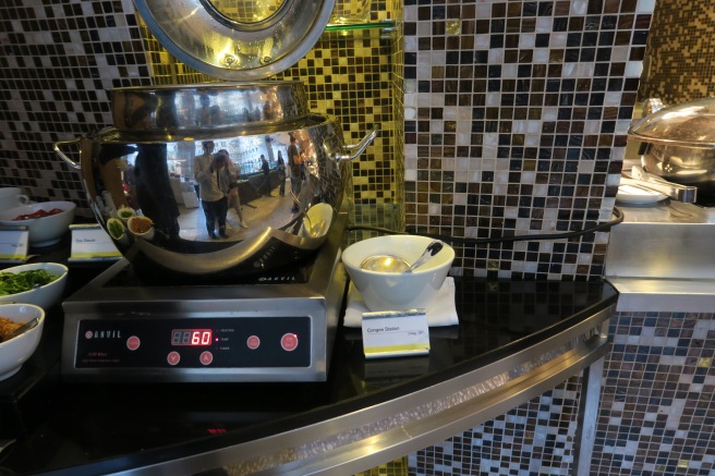 a large silver pot on a counter