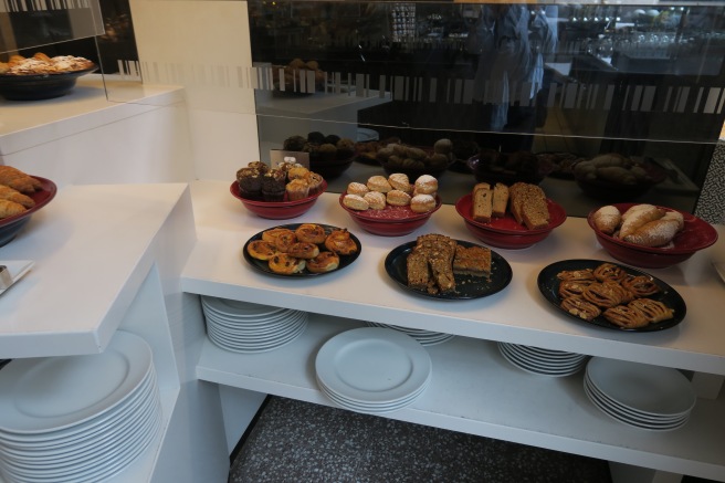 a display of pastries on a shelf