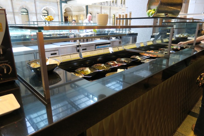 a buffet line with food on it