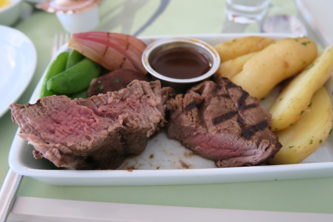 a plate of meat and vegetables